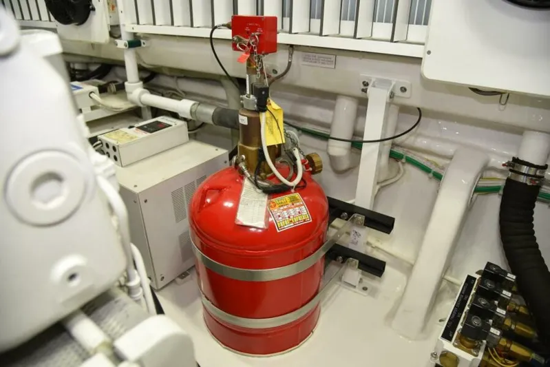 Another Day In Paradise Yacht Photos Pics Engine room of 2017 Viking 80 Sky Bridge with fire suppression system.