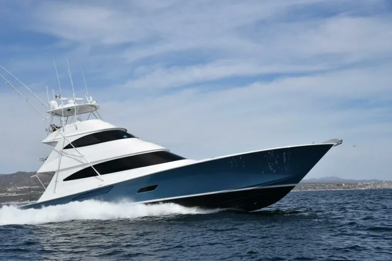 Another Day In Paradise Yacht Photos Pics 2017 Viking 80 Sky Bridge yacht cruising on open water under a clear sky.