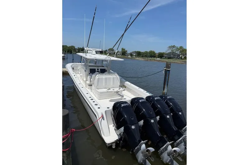  Yacht Photos Pics 2018 Invincible 42 Open Fisherman boat docked with four powerful engines.