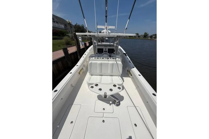  Yacht Photos Pics 2018 Invincible 42 Open Fisherman boat interior with seating and fishing rod holders.