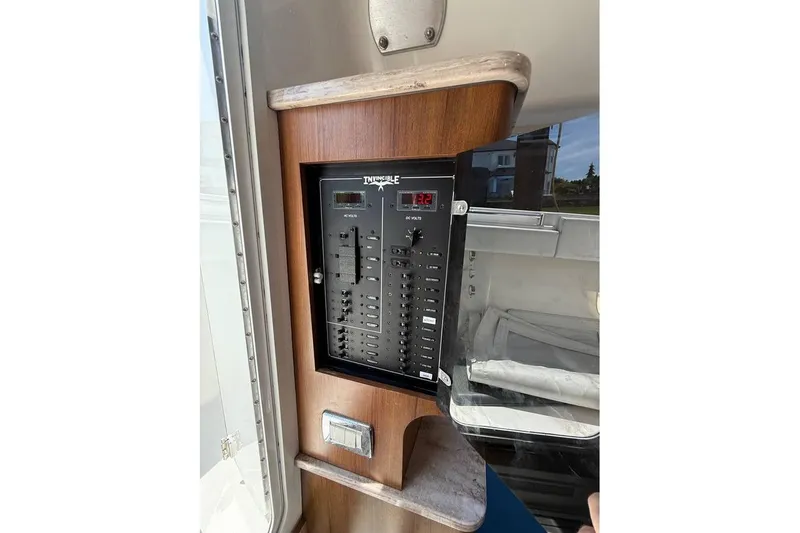  Yacht Photos Pics Electrical panel on a 2018 Invincible 42 Open Fisherman boat, featuring switches and voltage display.