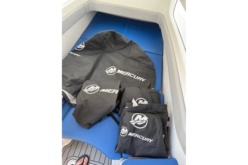  Yacht Photos Pics Mercury-branded gear on blue seating of 2018 Invincible 42 Open Fisherman boat.