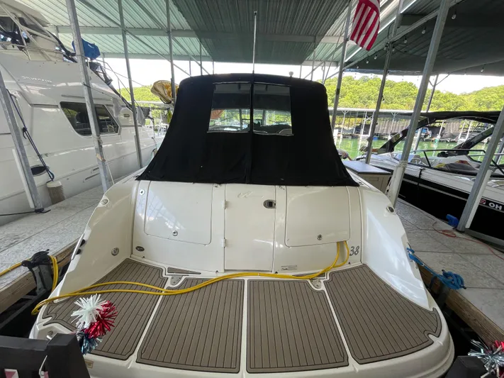 Yacht Photos Pics 2007 Sea Ray 38 Sundancer docked, rear view with covered cockpit and swim platform.