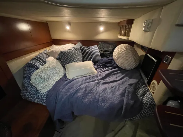  Yacht Photos Pics Cozy cabin interior of 2007 Sea Ray 38 Sundancer with plush bedding and ambient lighting.