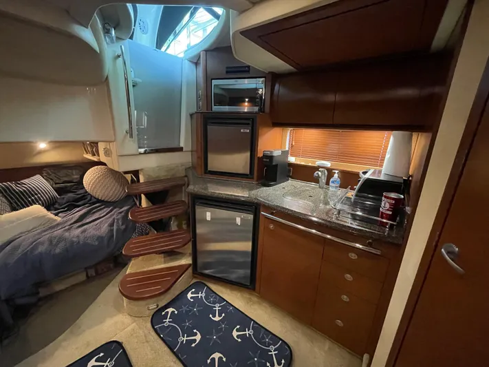  Yacht Photos Pics Interior of 2007 Sea Ray 38 Sundancer yacht with kitchen and sleeping area.
