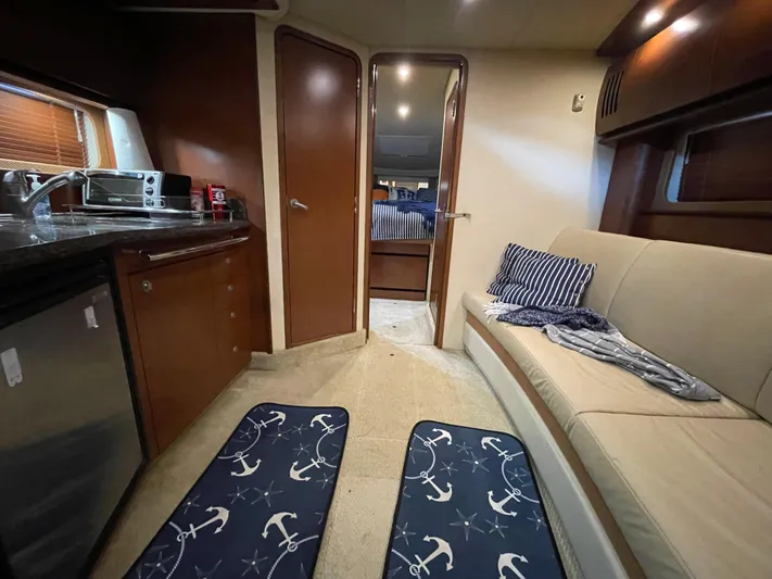  Yacht Photos Pics Interior of 2007 Sea Ray 38 Sundancer yacht with kitchen and seating area.