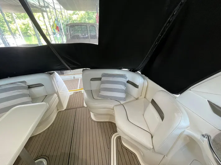  Yacht Photos Pics Interior seating area of a 2007 Sea Ray 38 Sundancer yacht with striped cushions.