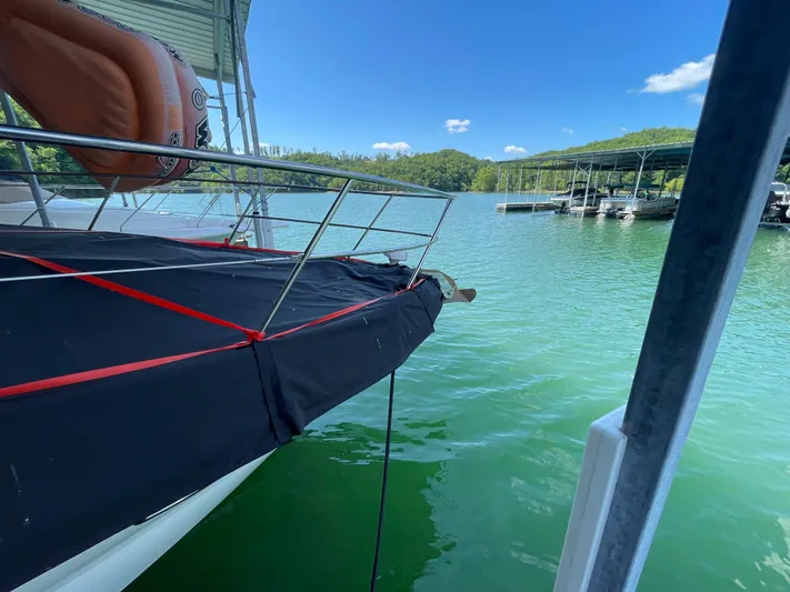  Yacht Photos Pics 2007 Sea Ray 38 Sundancer docked on a serene lake with clear skies.