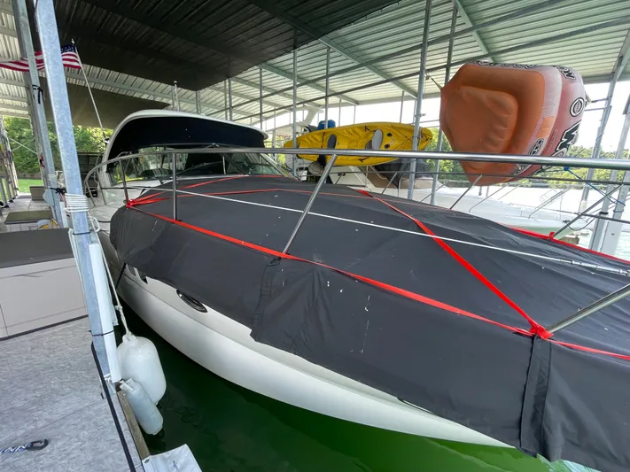  Yacht Photos Pics 2007 Sea Ray 38 Sundancer yacht docked under covered marina.