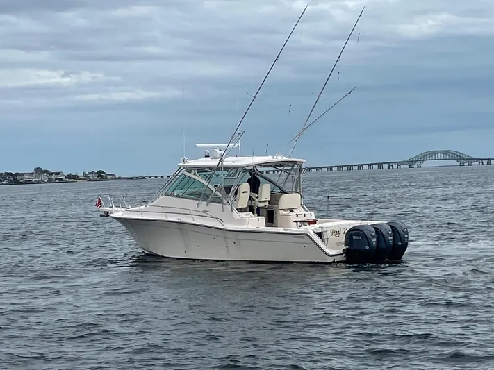  Yacht Photos Pics 2007 Grady-White Express 360 boat on water with bridge in background.