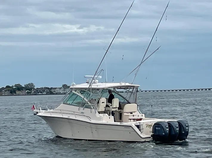  Yacht Photos Pics 2007 Grady-White Express 360 boat on water with fishing rods and twin engines.