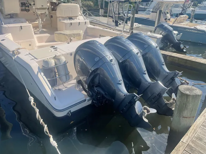  Yacht Photos Pics 2007 Grady-White Express 360 boat with triple outboard engines docked at marina.