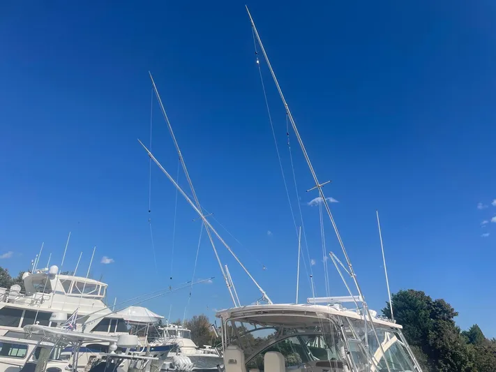  Yacht Photos Pics 2007 Grady-White Express 360 boat with tall masts under clear blue sky.