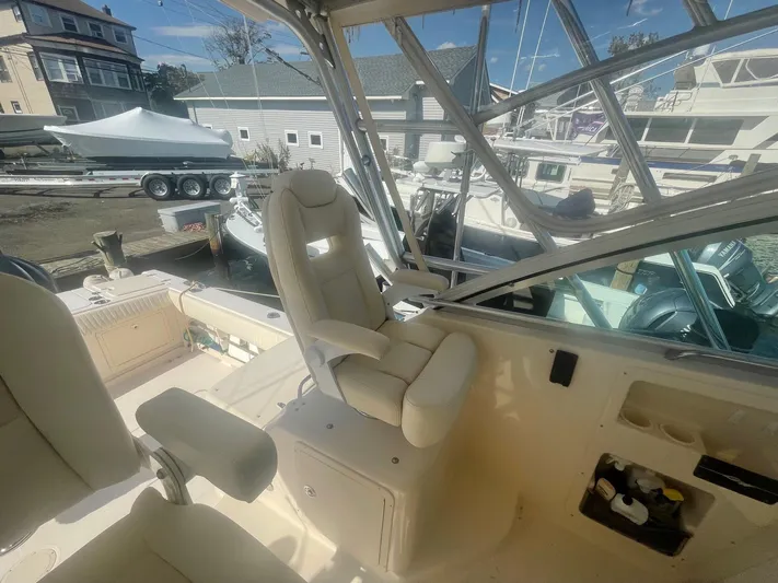  Yacht Photos Pics 2007 Grady-White Express 360 boat interior with captain's chair and marina view.