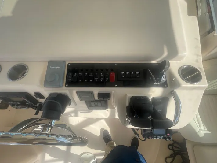  Yacht Photos Pics 2007 Grady-White Express 360 helm with control panel and steering wheel.