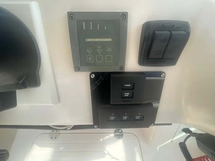  Yacht Photos Pics Control panel of a 2007 Grady-White Express 360 boat with switches and indicators.