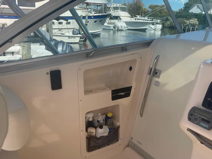  Yacht Photos Pics 2007 Grady-White Express 360 boat interior with storage compartment, docked at marina.