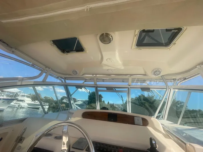  Yacht Photos Pics Interior view of 2007 Grady-White Express 360 boat cockpit with clear windows and steering wheel.