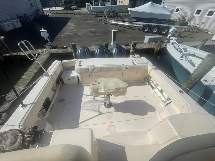  Yacht Photos Pics 2007 Grady-White Express 360 boat docked, featuring spacious deck and triple outboard engines.