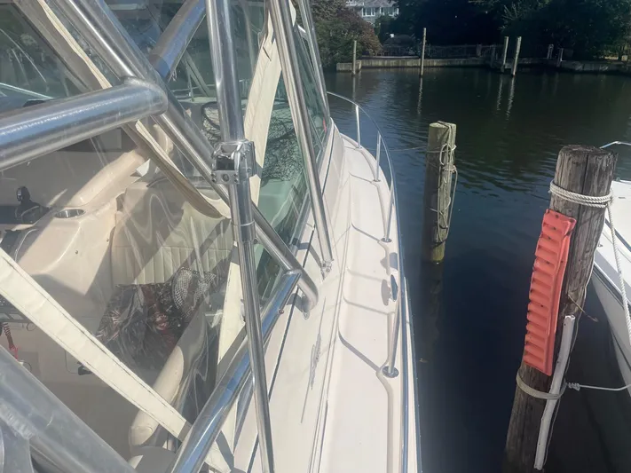  Yacht Photos Pics 2007 Grady-White Express 360 boat docked by wooden posts in a marina.