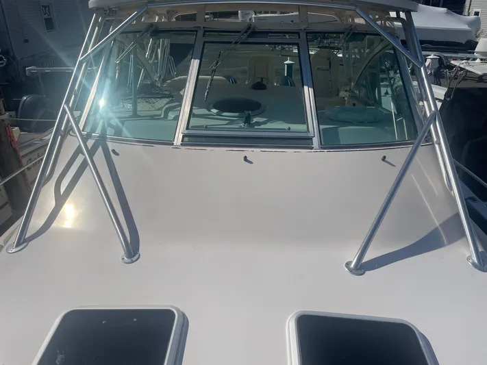  Yacht Photos Pics 2007 Grady-White Express 360 boat, front view with windshield and metal framework.