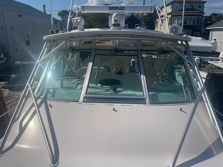  Yacht Photos Pics 2007 Grady-White Express 360 boat with Simrad equipment, docked in a marina.