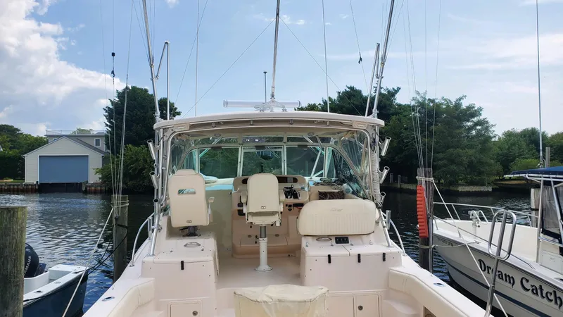  Yacht Photos Pics 2007 Grady-White Express 360 boat docked, featuring spacious cockpit and fishing equipment.
