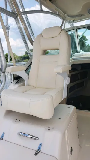  Yacht Photos Pics Captain's chair on 2007 Grady-White Express 360 boat, featuring luxurious white upholstery.