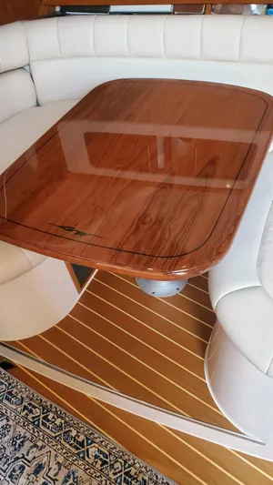  Yacht Photos Pics 2007 Grady-White Express 360 interior with wooden table and white seating.