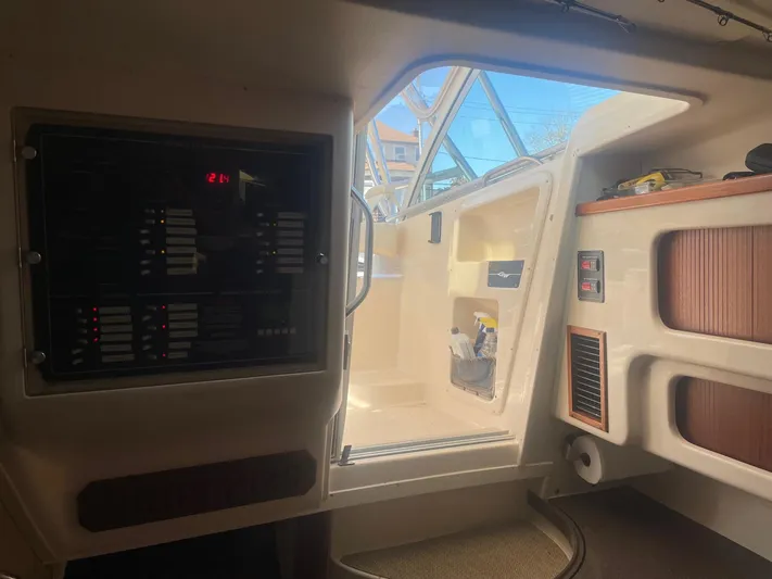  Yacht Photos Pics 2007 Grady-White Express 360 cabin interior with control panel and open hatch.