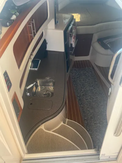  Yacht Photos Pics 2007 Grady-White Express 360 cabin interior with kitchenette and seating area.