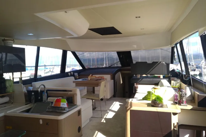 Yacht Photos Pics Luxurious interior of a 2016 Prestige 550 yacht with modern furnishings and ample natural light.