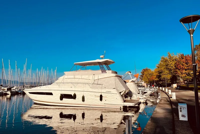  Yacht Photos Pics Luxury 2016 Prestige 550 yacht docked at marina under clear blue sky.