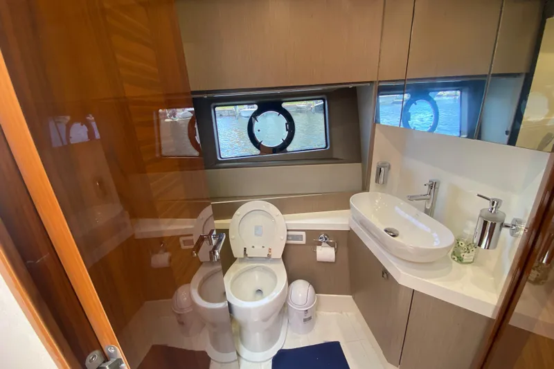 Gaia Yacht Photos Pics Luxurious bathroom in 2017 Sunseeker Manhattan 52 yacht with modern fixtures and ocean view.