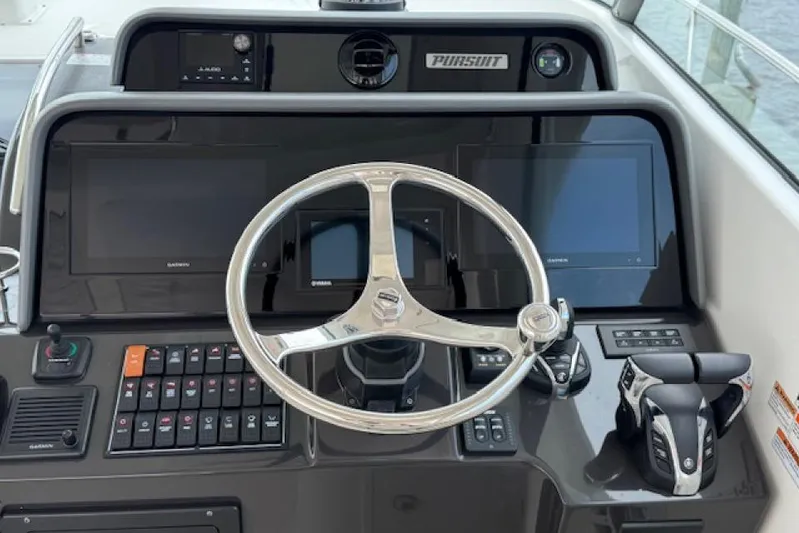 Nothing But Fine Yacht Photos Pics Helm of 2022 Pursuit OS 385 Offshore boat with modern controls and displays.