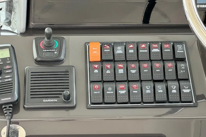 Nothing But Fine Yacht Photos Pics Control panel of a 2022 Pursuit OS 385 Offshore boat with Garmin equipment.