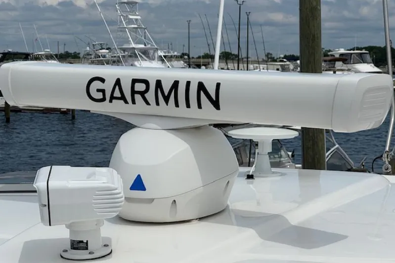 Nothing But Fine Yacht Photos Pics Garmin radar on 2022 Pursuit OS 385 Offshore boat, docked at marina.