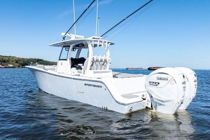  Yacht Photos Pics 2024 Sportsman Open 322 Center Console boat with Yamaha engines on calm water.