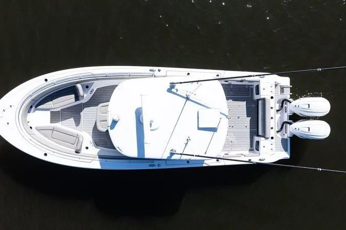  Yacht Photos Pics 2024 Sportsman Open 322 Center Console boat, aerial view, on dark water.