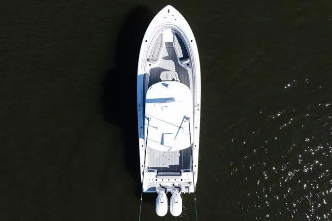  Yacht Photos Pics 2024 Sportsman Open 322 Center Console boat, aerial view on dark water.