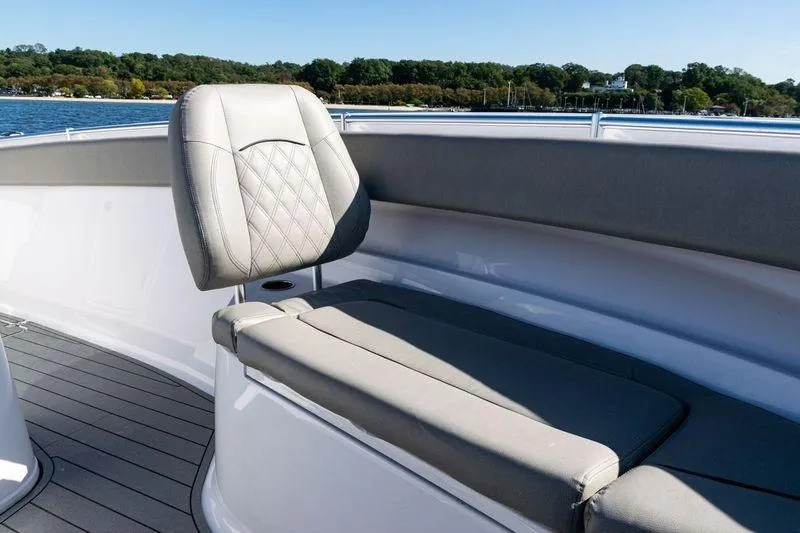  Yacht Photos Pics 2024 Sportsman Open 322 Center Console boat seating area with elegant upholstery.