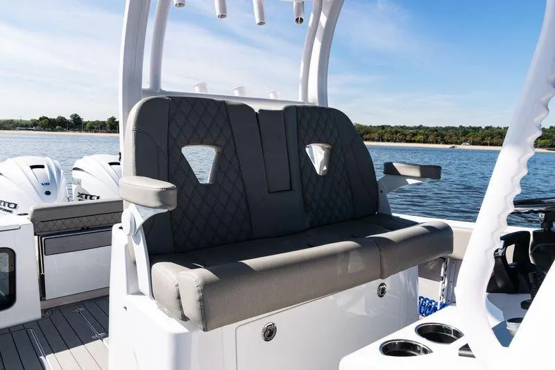  Yacht Photos Pics 2024 Sportsman Open 322 Center Console boat interior with seating and ocean view.