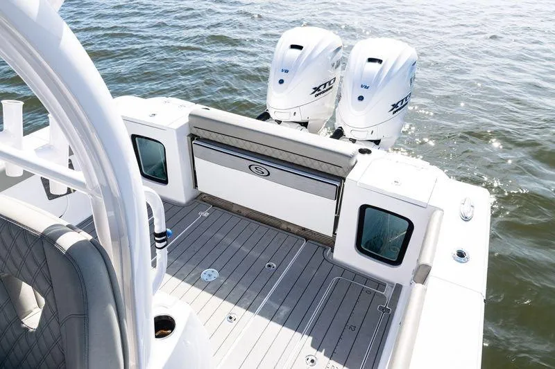  Yacht Photos Pics 2024 Sportsman Open 322 Center Console boat with twin engines on water.