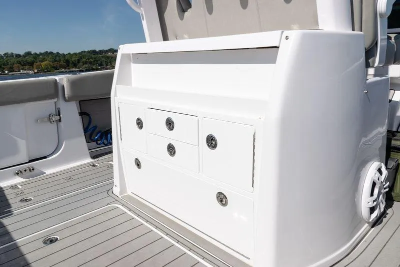  Yacht Photos Pics 2024 Sportsman Open 322 Center Console boat interior with storage compartments.