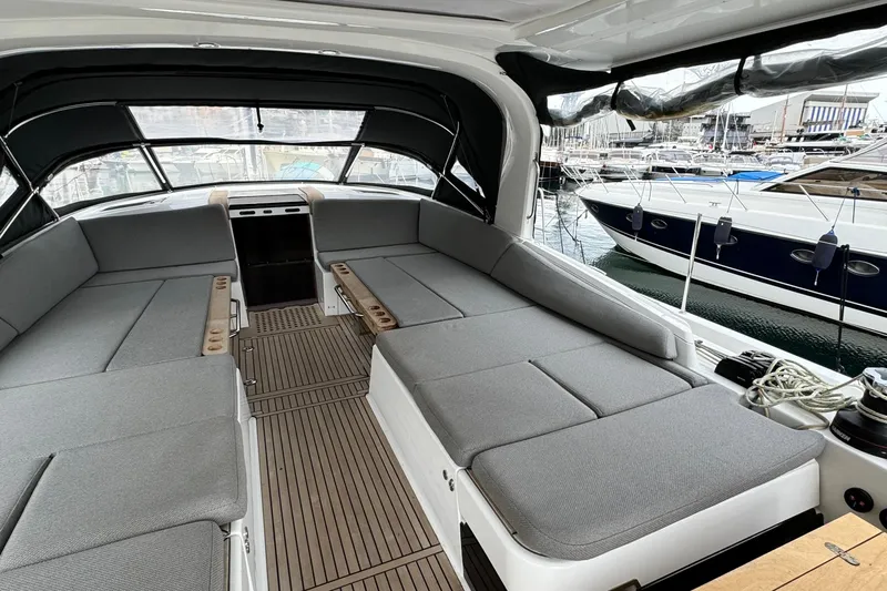  Yacht Photos Pics Luxurious 2023 Jeanneau 65 Yacht interior with spacious seating and elegant design.