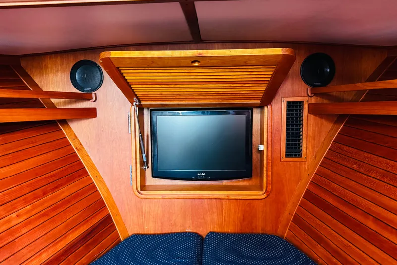 Maverick Yacht Photos Pics Interior of 2012 Hinckley Picnic Boat MKIII with wooden paneling and built-in TV.