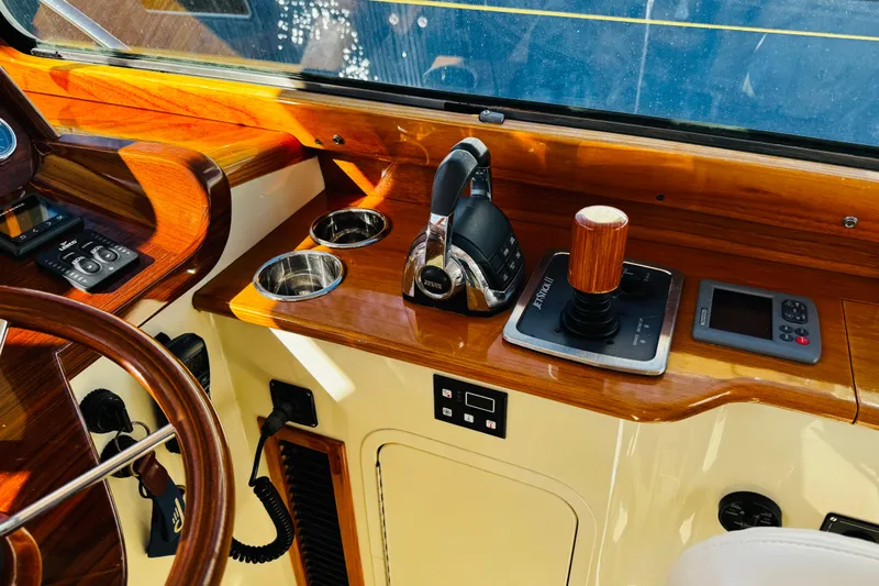 Maverick Yacht Photos Pics Hinckley Picnic Boat MKIII 2012 helm with wooden accents and modern controls.