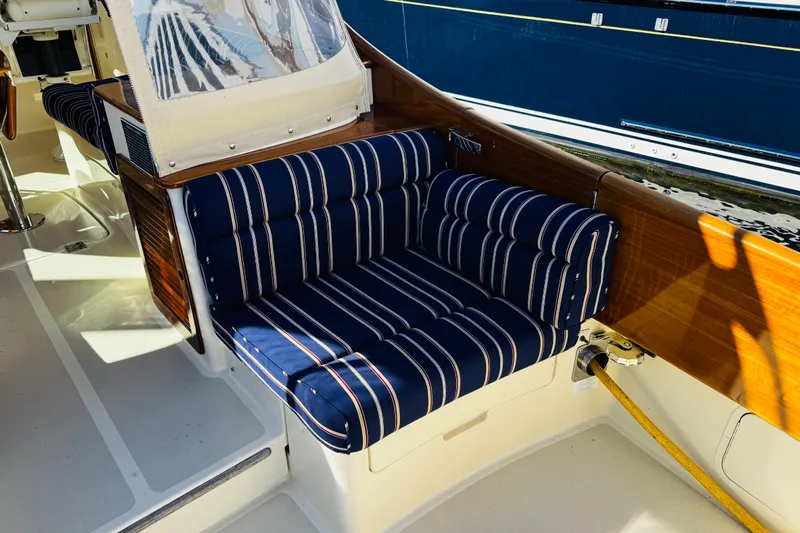 Maverick Yacht Photos Pics 2012 Hinckley Picnic Boat MKIII with striped seating and wooden accents.