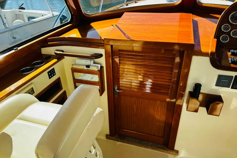 Maverick Yacht Photos Pics Interior of 2012 Hinckley Picnic Boat MKIII with polished wood and leather seating.