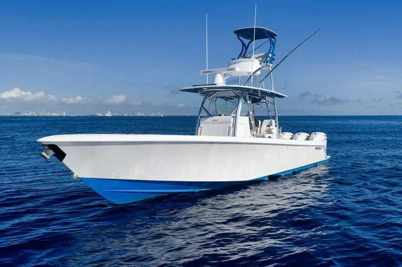 Top Shelf Too Yacht Photos Pics 2023 Contender 39 ST boat on open ocean under clear blue sky.